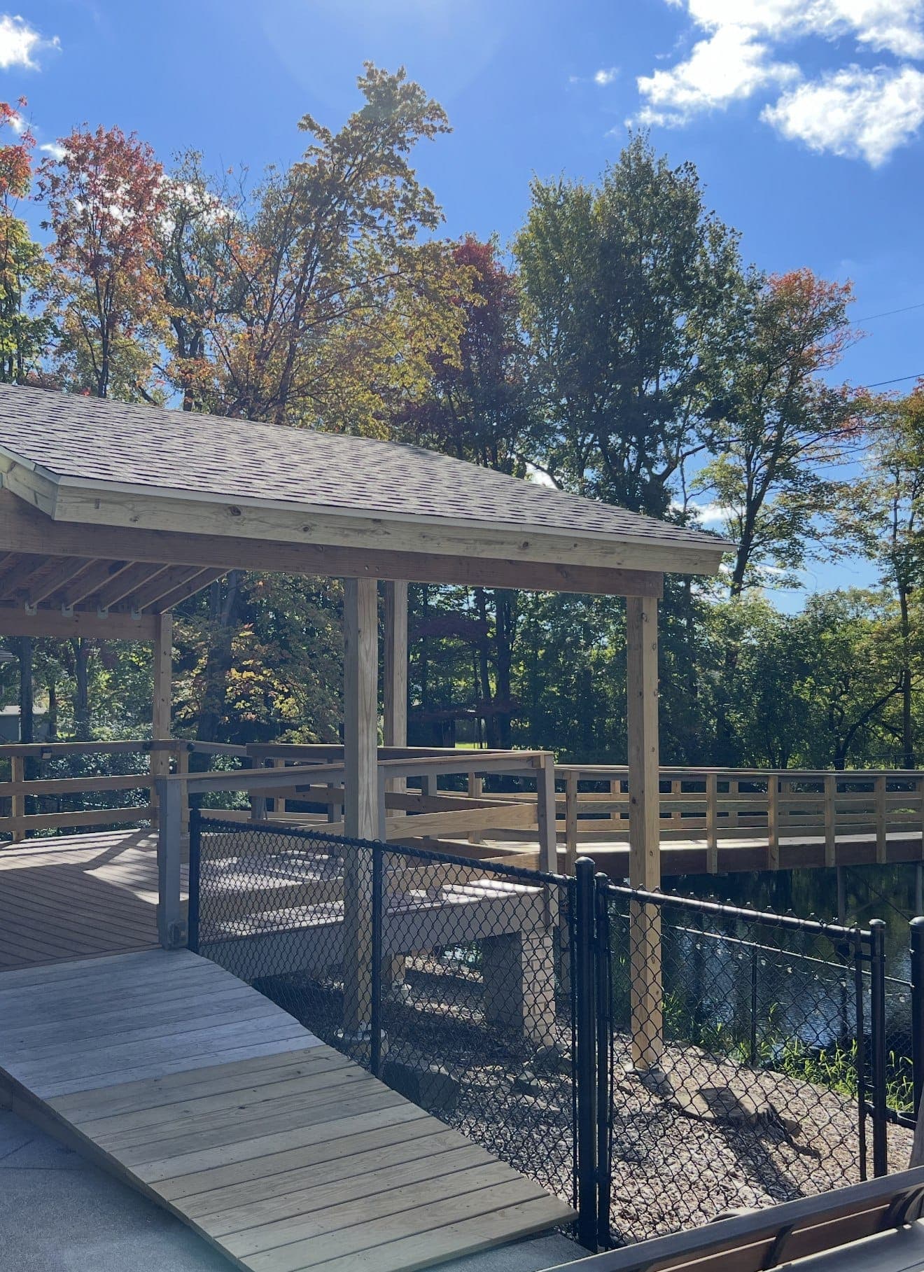 Completed custom gazebo with a wood deck and railing
