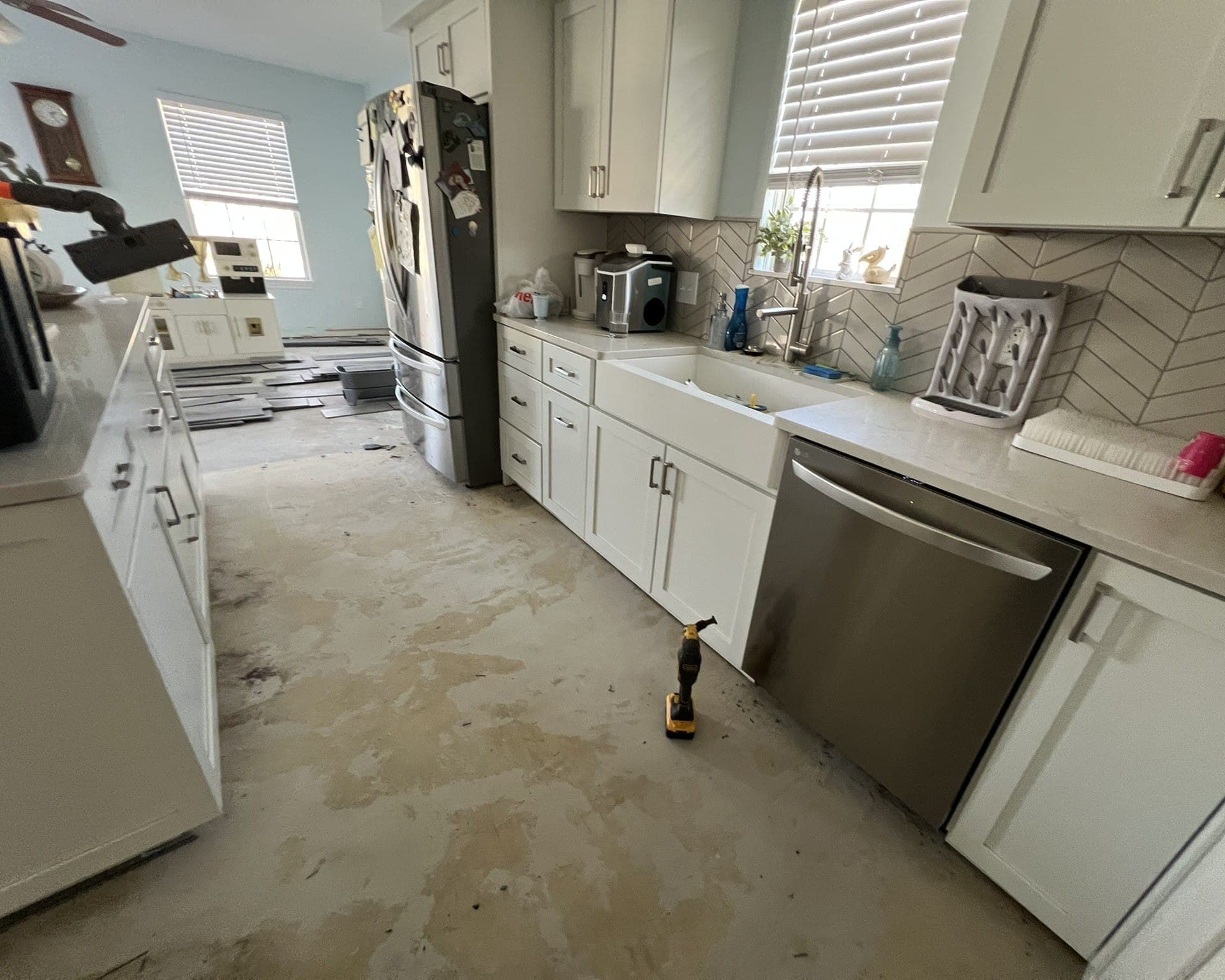 Kitchen with old flooring removed down to the subfloor